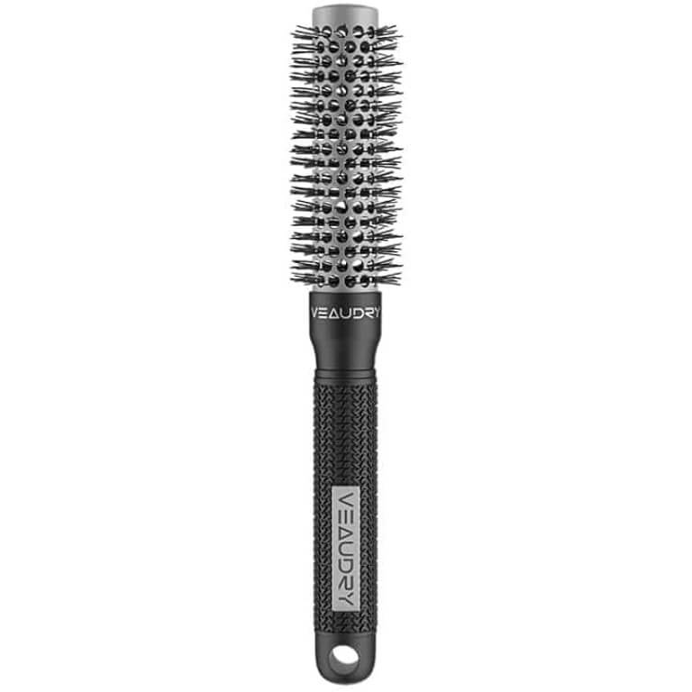 A black hair brush on a white background.