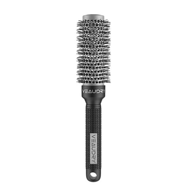 A veaudry hair brush on a white background.