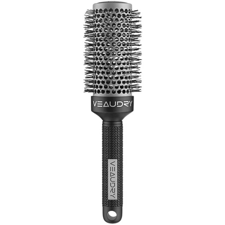 A black hair brush on a white background.