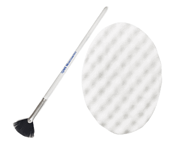 A white brush and a white pad on a black background.