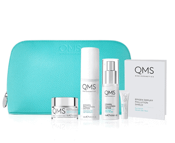 Oms skin care set in a blue bag.