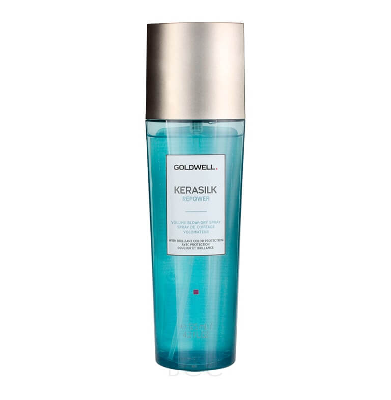 A bottle of kerastase with blue water on a white background.
