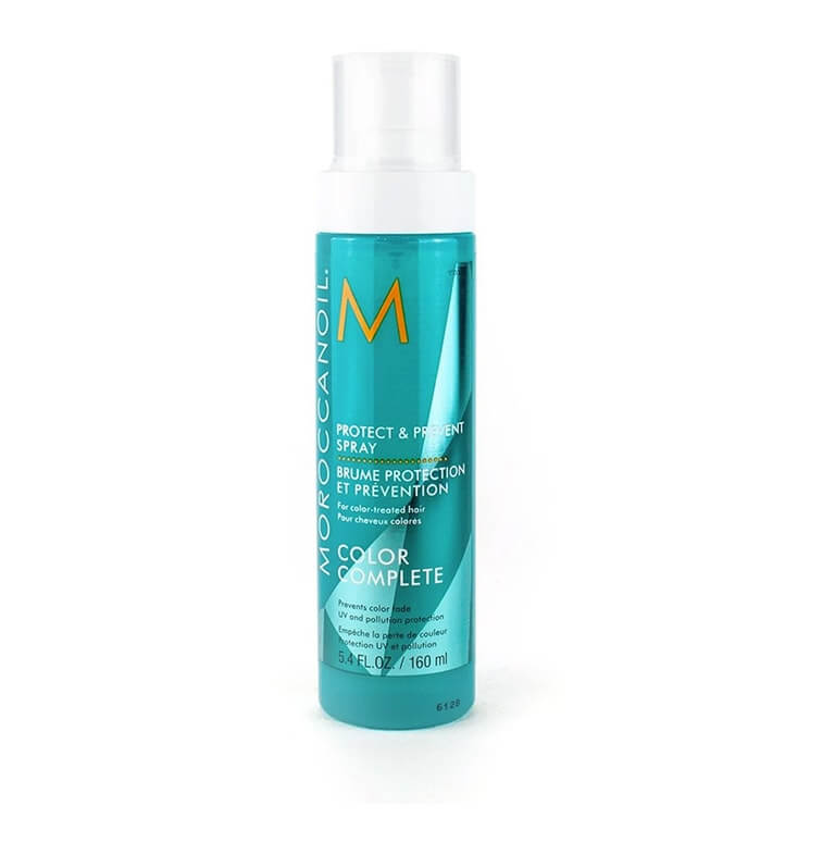 A bottle of moroccan hair spray on a white background.
