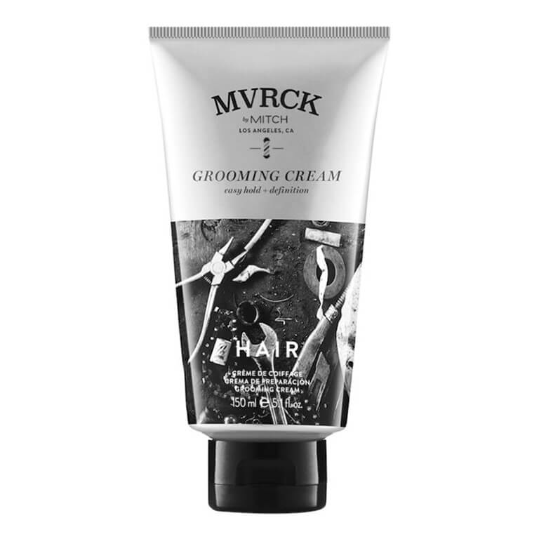 A tube of mvick grooming cream on a white background.