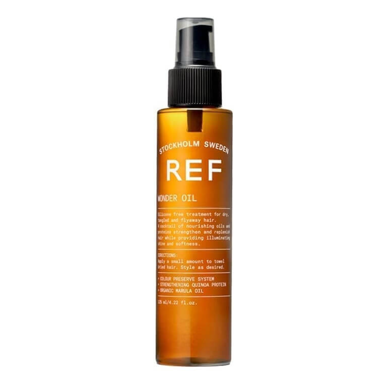 A bottle of ref oil on a white background.