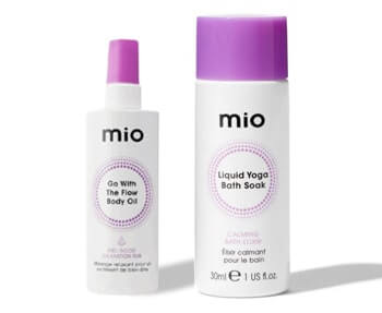 A bottle of mio body spray and a bottle of lotion.