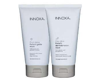 Two tubes of inoxa face mask on a white background.