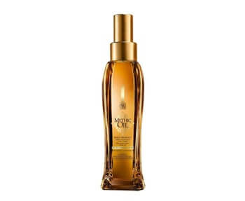 A bottle of hair oil with a golden bottle on a white background.