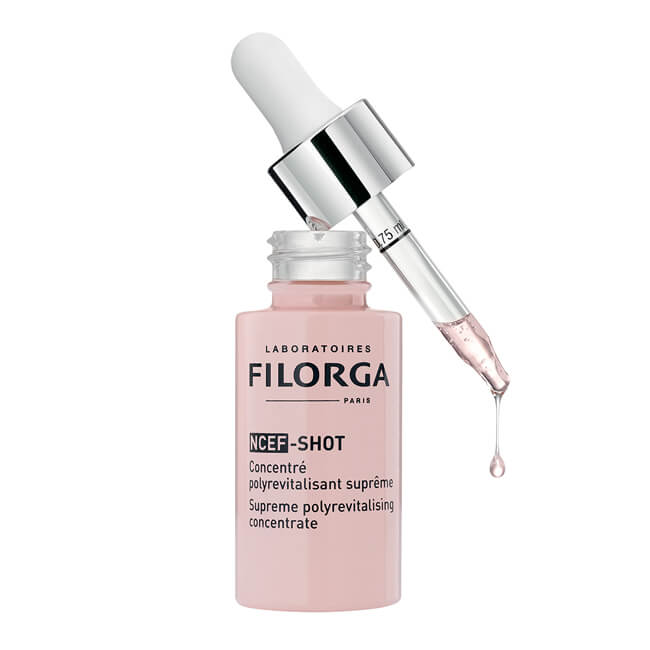 A bottle of Filorga - NCEF Shot serum with a drop of pink NCEF Shot liquid.