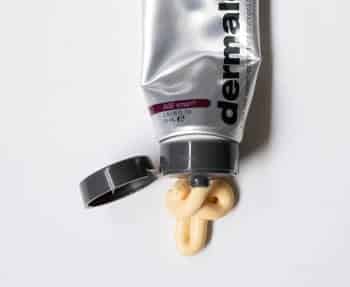 A tube of Dermalogica face cream on a white surface.