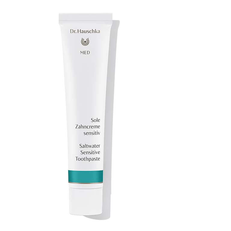 A tube of Dr. Hauschka - Med Saltwater Sensitive Toothpaste 75ml on a white background next to Dr. Hauschka - Med Saltwater Sensitive Toothpaste 75ml.