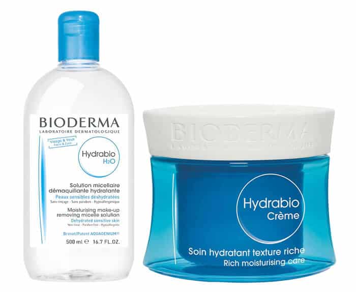 A bottle of water and a bottle of bioderma hyaluronic acid.