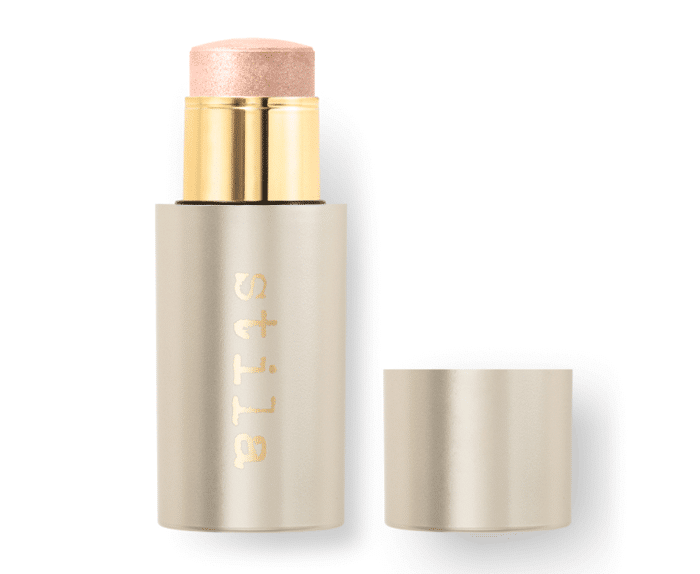 A highlight stick with a gold lid on a white background.
