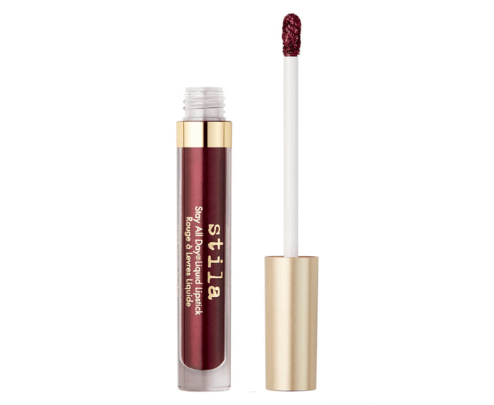 Lipgloss in burgundy with a gold lid.