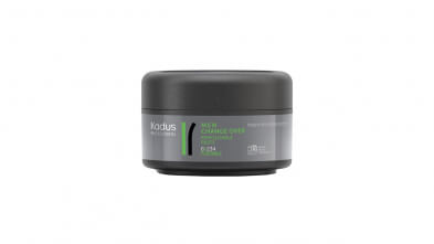 A jar with a black lid on a white background, featuring Kadus Professionals - Change Over Paste 75ml.