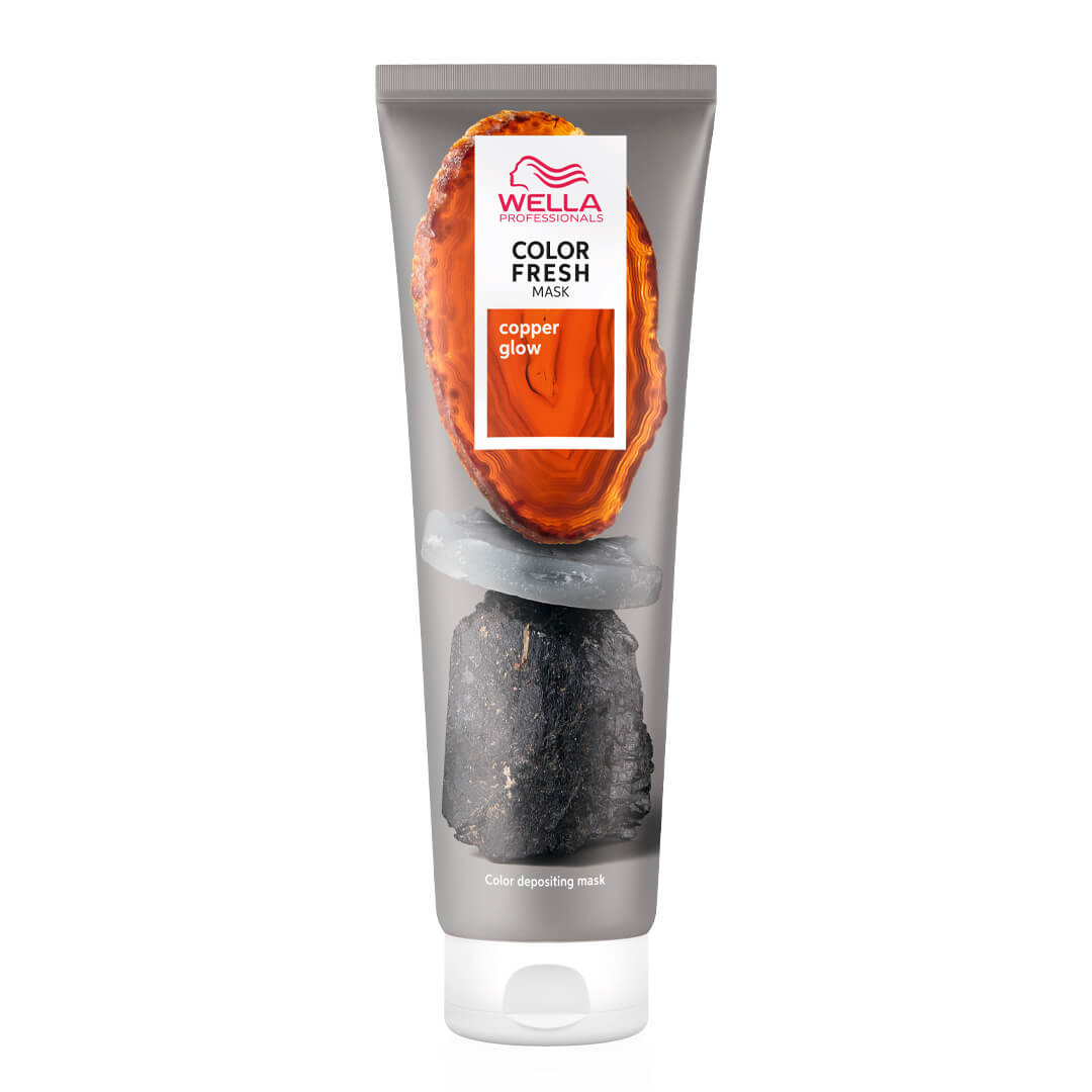 A tube of hair color with an orange tube on a white background.