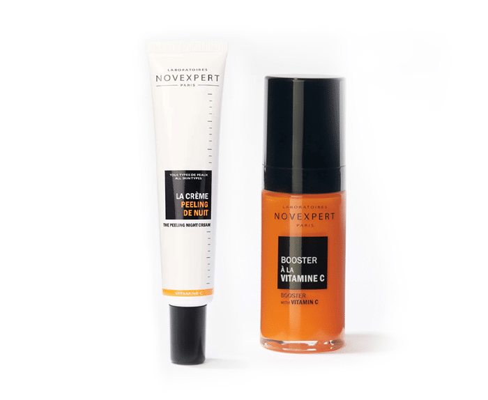 A tube of orange eye cream and a tube of orange eye cream.