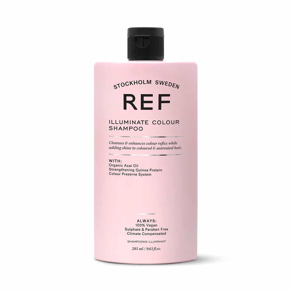 A bottle of ref ultimate colour shampoo on a white background.