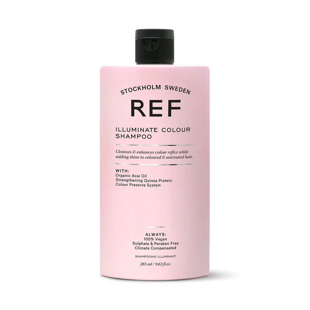 A bottle of ref ultimate colour shampoo on a white background.