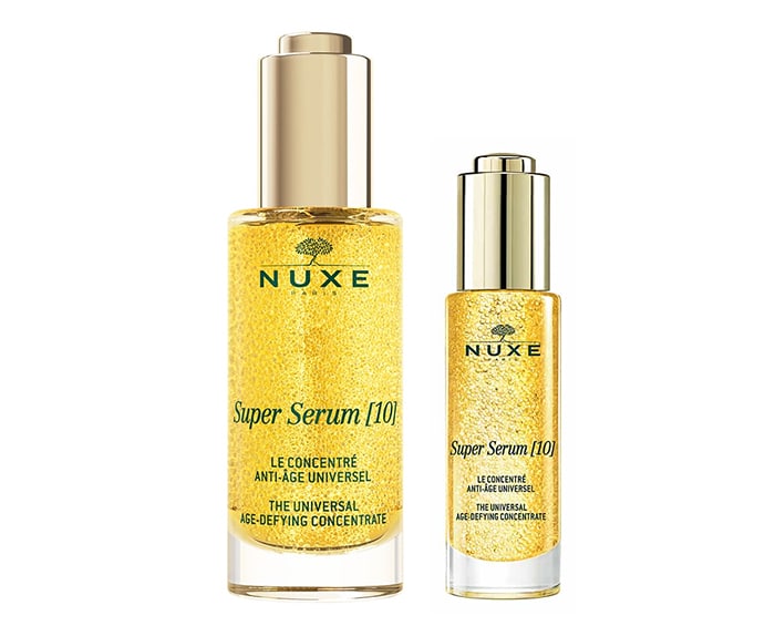 Two bottles of nuxe super serum oil.