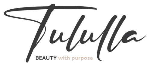 The logo for tulula beauty with purpose.