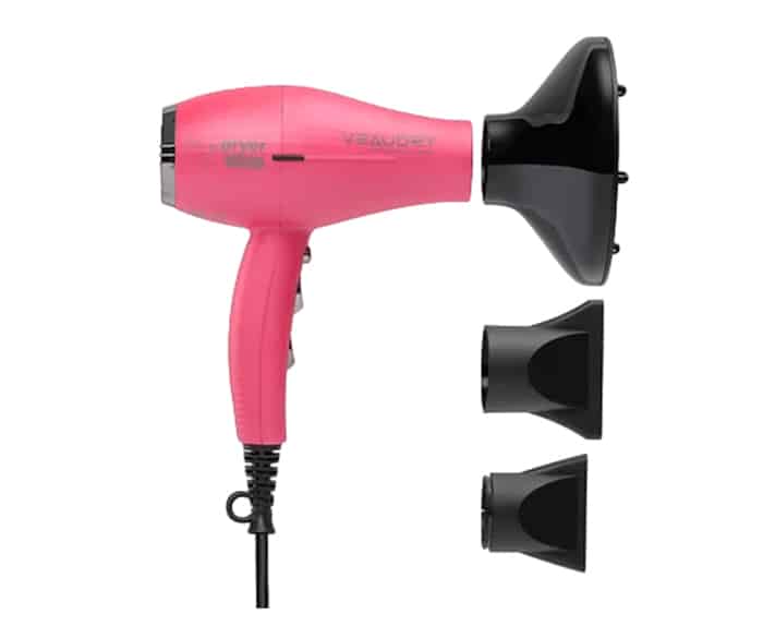 A pink Veaudry hair dryer on a white background.